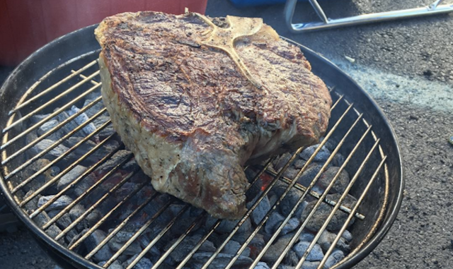 Fans grill 96-oz. steak at Jets-Dolphins tailgate