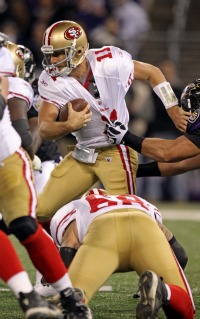 A. Smith was sacked nine times by Baltimore (US Presswire).