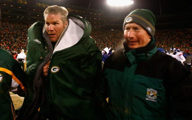 Brett Favre doesn't want to be honored unless Bart Starr, right, is at Lambeau Field. (Getty Images)