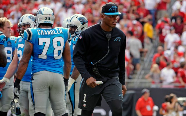 Cam Newton could do nothing but roam the sidelines Sunday. (USATSI)