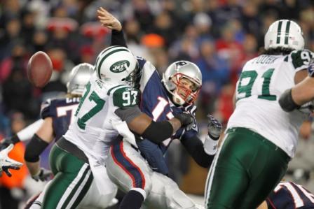C. Pace forces a fumble on T. Brady in New York's win (US Presswire).