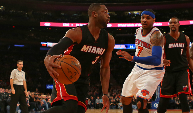 Melo and Wade try to derail the other. (USATSI)