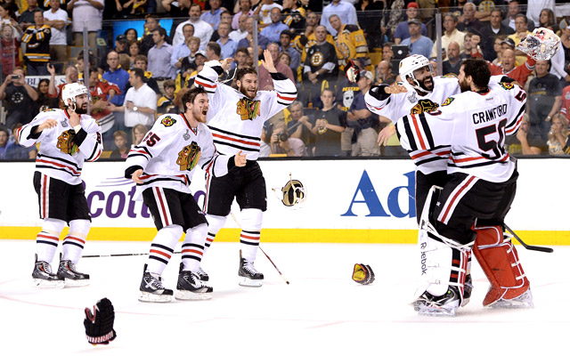 Johnny Oduya and Corey Crawford start the celebration.