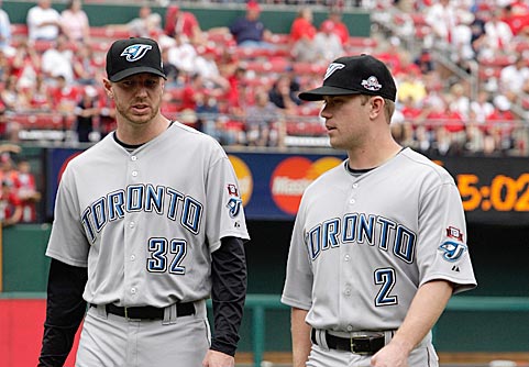 Toronto should keep Halladay (left) for 2010 and Aaron Hill for the long haul. 