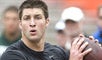 Tim Tebow threw for over 9,000 yards in his college career. (AP)