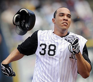 Rockies ace Ubaldo Jimenez not only gets it done on the mound but also shows off his skills on the basepaths.  (AP)