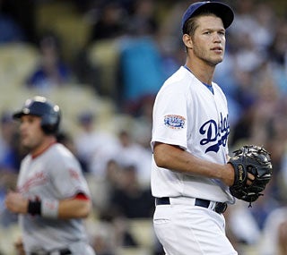 Dodgers lefty Clayton Kershaw gives up two three-run shots and is saddled with the loss.  (AP)