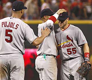 Skip Schumaker (right) hits his first grand slam -- only his 19th career homer -- to propel St. Louis. (AP)