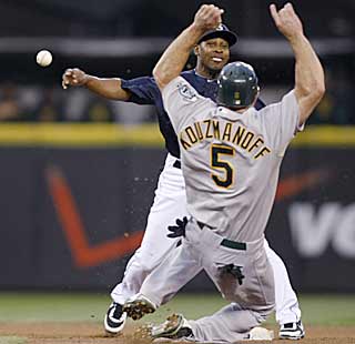 Chone Figgins gets the out at second before going to first to complete the M's first triple play in 15 years. (AP)