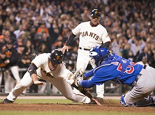 Travis Ishikawa tries to end the game in the 10th inning, but Koyie Hill tags him for the third out.  (US Presswire)