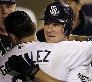 Ryan Ludwick gets a hug from Adrian Gonzalez after the new Padre hits his second homer of the night.  (AP)