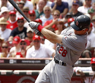 Colby Rasmus' first career grand slam comes on his 24th birthday and it helps the Cards take over first place. (AP)