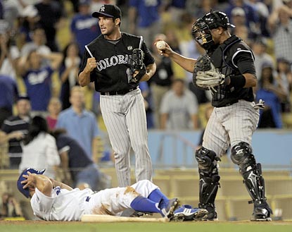 Rockies closer Huston Street celebrates after Miguel Olivo applies the tag on Reed Johnson for the game's final out.  (AP)