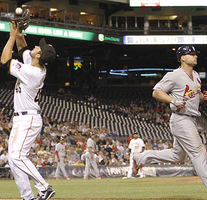 Matt Holliday blows a bases-loaded opportunity in the ninth when he hits a harmless pop fly. (AP)