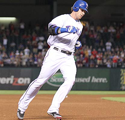 Josh Hamilton rounds third after he hits a solo home run in the fourth to tie up the game at two. (US Presswire)