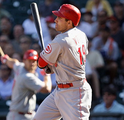 Joey Votto completes this game with his fourth hit, a two-out single that drives in the go-ahead run in the 12th inning. (Getty Images)