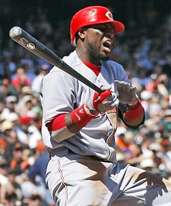 Brandon Phillips suffers an injury in the gutty win, a cause for concern. (AP)