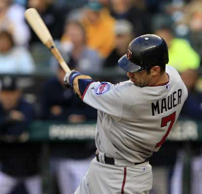 Joe Mauer snags three hits and two RBI in a stellar outing against the Mariners. (AP)