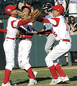 The Japanese team rejoices after ending the United States' five-year run as Little League champs. (AP)