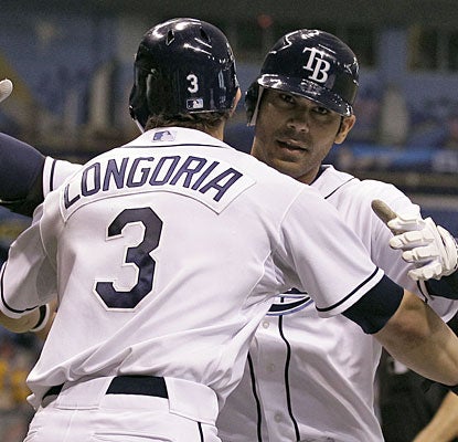 Evan Longoria greets Carlos Pena after Pena's three-run shot in the third inning.  (AP)