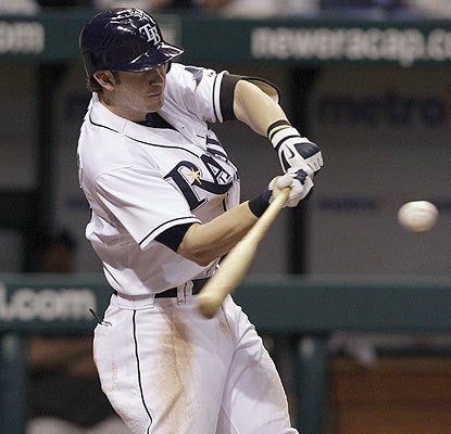 Evan Longoria gets the pitch he wants from Shawn Camp in the eighth and lines an RBI single. (AP)