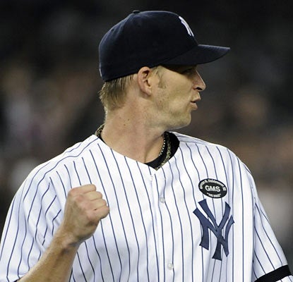 A.J. Burnett is happy to leave August behind -- winless with a 7.80 ERA in the month -- as he earns his first W since July 28. (AP)