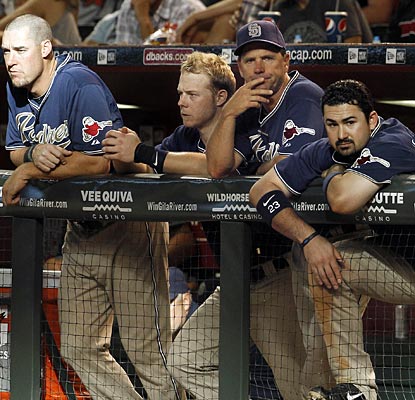 The Padres look on as their losing streak reaches seven and their division lead continues to dwindle.  (AP)