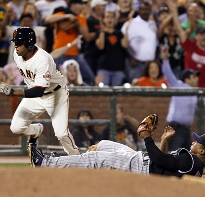 Called up on Wednesday, Darren Ford races home for the go-ahead run with Melvin Mora powerless to stop him.  (AP)