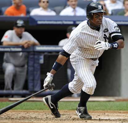 Curtis Granderson smacks a pair of doubles and drives in three runs to lead the Yanks past the Blue Jays. (AP)