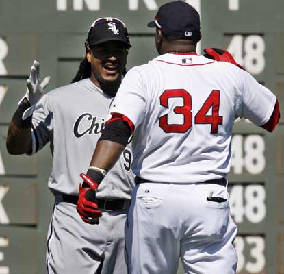 Manny Ramirez and David Ortiz catch up on old times before Ramirez singles twice in the game to help the ChiSox down Boston.  (AP)