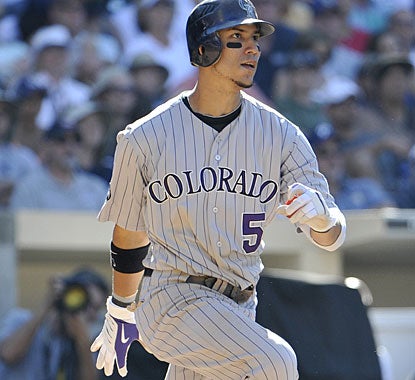 NL batting leader Carlos Gonzalez ups his average to .335 with three hits. He also has a 12-game hitting streak. (AP)