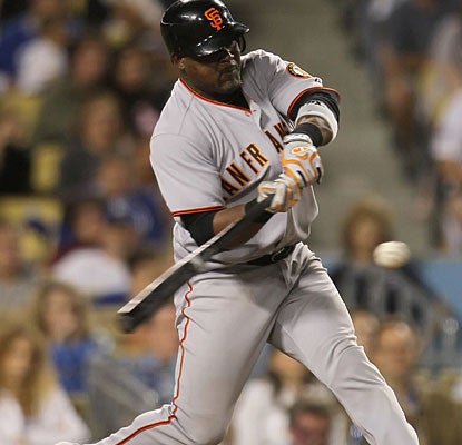 After going without a hit in his first three at-bats, Juan Uribe comes up with a big two-run homer in the ninth inning. (Getty Images)