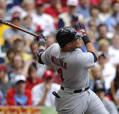 Yadier Molina helps the Cards stay alive in the NL Central after smacking a slam to cap a six-run eighth against the Brewers.  (AP)