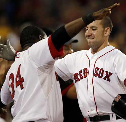 Ryan Kalish jogs into the open arms of David Ortiz after knocking a grand slam to help the BoSox dominate the Rays. (AP)