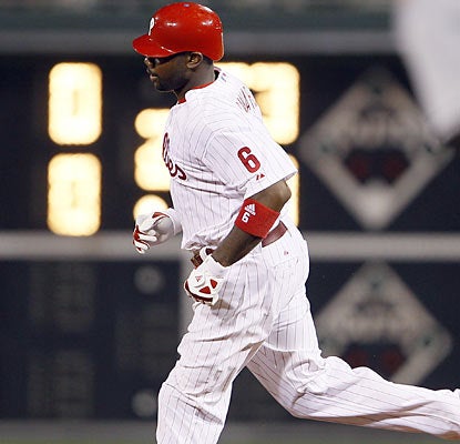 Ryan Howard chips in for the Phillies by providing a solo shot along with three runs against the Marlins.  (AP)