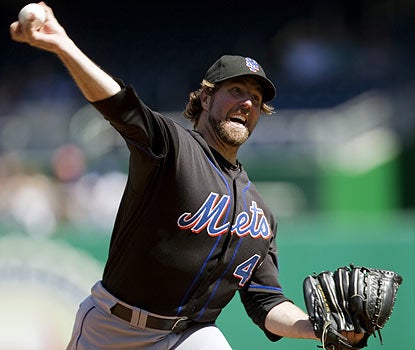 Despite a fall, R. A. Dickey keeps his head in the game to earn his first win at Washington in three tries this season. (AP)
