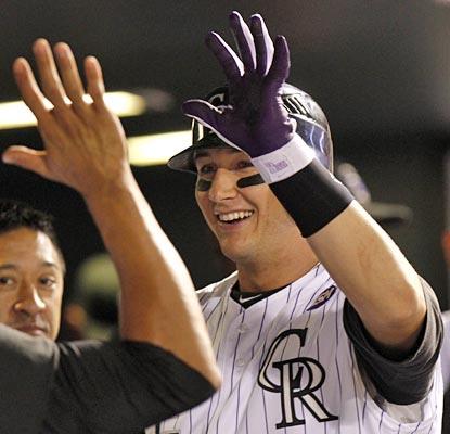 Troy Tulowitzki is all smiles with his two-homer night to help keep the Rockies red hot.  (AP)