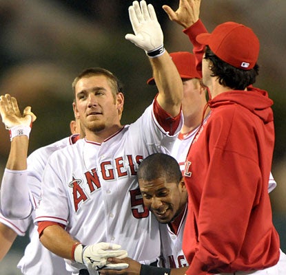 It's celebration all-around for Jeff Mathis, who drives in the winning run with a sacrifice fly. (US Presswire)