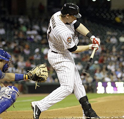 Astros rookie Chris Johnson squares up his eighth homer of the season, a three-run shot that rallies  Houston.  (AP)