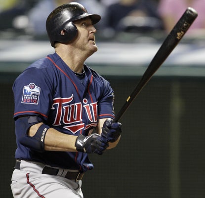 Jim Thome watches his 587th career HR fly over the wall -- a swing that lifts him past Frank Robinson on the all-time HR list.  (AP)
