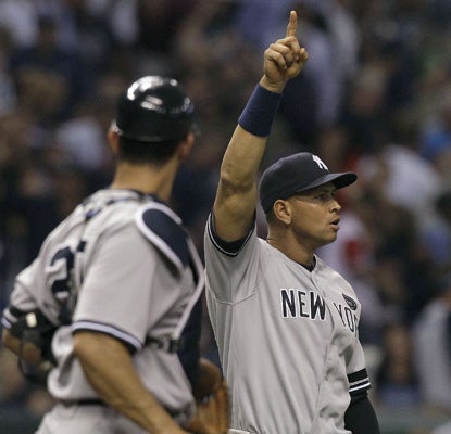 Alex Rodriguez celebrates with Jorge Posada after the Yanks' win over the Rays propels them back into first place in the East. (AP)