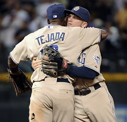 Infielders Miguel Tejada and David Eckstein combine for four hits and three RBI as the Padres extend their slim NL West lead. (AP)