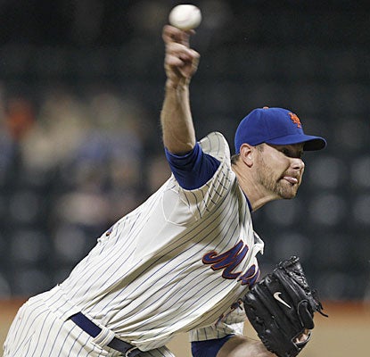 Mike Pelfrey allows two runs and six hits in seven innings to improve his record to 15-9.  (AP)
