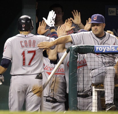 Shin-Soo Choo jogs into the dugout after hitting a solo home run in the eighth -- his third HR of the day.  (AP)