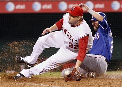 Jeff Francoeur, whose double off Matt Palmer (32) leads off the 12th inning, scores the winning run on a passed ball.  (AP)