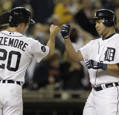Jhonny Peralta is congratulated by teammate Scott Sizemore after hitting a three-run shot against the Twins. (Getty Images)