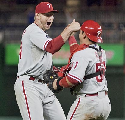 Roy Halladay punches his first postseason ticket by shutting the Nationals out on just two hits.  (AP)