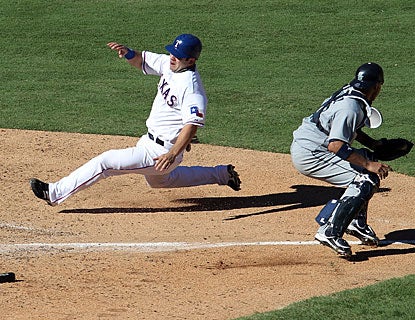 Mitch Mooreland hustles to score the winning run from first base after a wild pitch and a throwing error. (Getty Images)