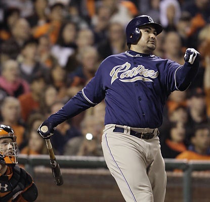 Adrian Gonzalez goes yard and drives in three, helping him surpass 30 home runs and 100 RBI on the season. (AP)