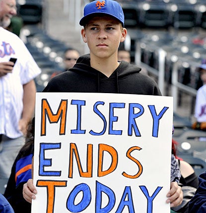 Mets fans watch their team cap its second straight losing season in embarrassing fashion.  (AP)